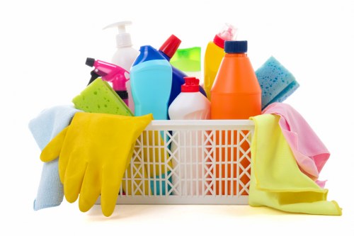Carpet cleaning team following safety procedures in a property